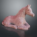 Red Terracotta Reclining Horse Sculpture With Textured Surface On Dark Background