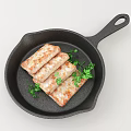 Pan Fried Meat Rolls in Black Cast Iron Skillet with Fresh Parsley