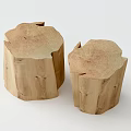Two Natural Wood Tree Stump Shaped Stools With Rustic Texture And Tree Rings