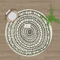 Round Black and White Mandala Geometric Pattern Rug with Open Book in Living Space