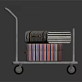 Metal Cart With Red Blue White Striped Packages And Wheels On Dark Background