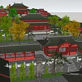 Classic Ancient Architecture Complex Featuring Red Roofs Central Archway And Green Trees