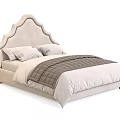 Modern Upholstered Double Bed With Curved Headboard Light Beige Pillows And Gray Quilted Blanket