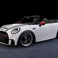 White Mini Convertible Car With Red Side Mirrors And Black Alloy Wheels