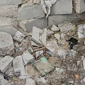 Rubble Pile With Gray Bricks Scattered Small Stones And Blue Green Debris