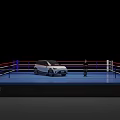 White SUV Parked on Blue Boxing Ring Platform with Person Standing