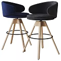 Modern Bar Stools Featuring Blue And White Upholstered Seats Wooden Legs And Black Metal Footrests