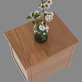 Wooden Nightstand With Smooth Surface And Green Vase Holding White Flowers