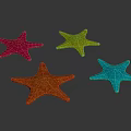 Four Colorful Starfish in Pink Green Orange and Blue on Black Background