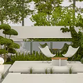 Outdoor Modern Courtyard Table and Chair Set With White Chairs Round Table and Greenery