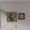 Abstract Painting On White Wall With Decorative Molding Dark Frame And Green Plant Accent