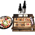 Assorted Sushi On Round Platter With Wooden Tray Sake Bottles And Small Dishes