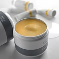 Reverse Skincare Products Open Jar Cream and Tubes with Yellow Formula