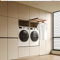 Beige Built in Laundry Area With Front Loading Washing Machines And White Shirt