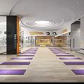 Spacious Fitness Studio with Yoga Mats Wooden Floors Glass Walls Ceiling Lights and Orange Decorations