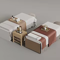 Relaxing Massage Room Setup With Two Beds Side Tables Towels And Bottles