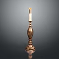 Decorative Brass Candlestick With Tall Design And Lit Candle On Black Surface