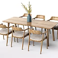 Wooden Dining Table Set With Six Chairs Padded Seats And Blue Vase Holding Yellow Flowers