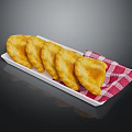 Golden Fried Dumplings Served On White Plate With Red And White Checkered Napkin