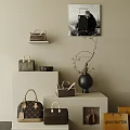Stylish Bags Display On Shelves With Decorative Vase And Artwork