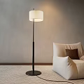 Modern Floor Lamp with Black Pole and White Shade by Beige Sofa and Gray Wall