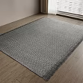 Square Gray Woven Rug With Fringe Edges On Wooden Floor In Bright Interior