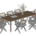 Wooden Dining Table Set With Black Frame Beige Seats Chairs And Dried Plant Vase