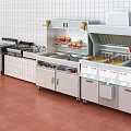Commercial Stainless Steel Kitchen Equipment With Multiple Cooktops Worktables And Storage Cabinets