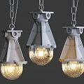 Three Modern Pendant Lights Featuring Metal Frames And Transparent Glass Shades