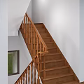 Classic Wooden Staircase Interior with Handrail Steps and White Walls Design