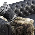 Luxurious Black Leather Three-Seater Sofa With Tufted Design Decorative Pillows And Fur Throw