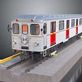 Silver Model Train With Red Doors Yellow Front Details On Tracks And Concrete Platform