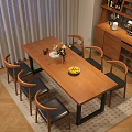 Modern Restaurant Interior With Wooden Dining Table Leather Chairs Wine Cabinet And Floral Decor