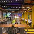 Modern Industrial Restaurant Interior With Graffiti Walls Metal Tables And Neon Lights