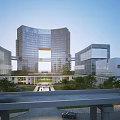 Modern Glassy Office Building Complex With Connected Structures And Surrounding Greenery