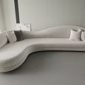 Modern Light Gray Curved Sectional Sofa With Comfortable Cushions In Minimalist Interior