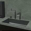 Sleek Black Washbasin with Modern Faucet on Green Speckled Countertop and Green Plant
