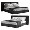 Modern Double Bed With Black Headboard White Sheets And Soft Throw Blanket