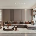 Modern Living Room Interior Design With Gray Sofa Brown Pillows Round Coffee Table And Lighting