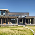 Modern Waterfront Detached Villa With Glass Facade Lush Lawn And Water View