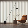 Stylish Orange Lounge Chair With Floor Lamp Plant Vase On Wooden Floor And Vertical Blinds