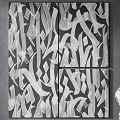 Black And White Abstract Painting With Four Panels On Gray Wall Near Sculpture