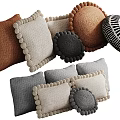 Colorful Knitted Decorative Pillows With Pom Pom Edges And Patterned Designs