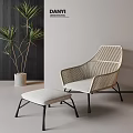 Modern Woven Single Chair With Light Cushion And Matching Ottoman Near Green Plant