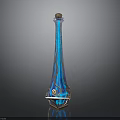 Tall Blue Glass Vase With Intricate Golden Swirl Patterns And Geometric Base