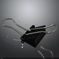 Black Binder Clip Office Supply With Sturdy Silver Metal Arms And Plastic Body