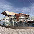 Modern Waterfront Architectural Design With Open Structure Glass Walls And Water Views