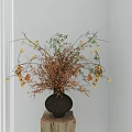 Stylish Vase With Orange And Green Decorative Flowers On Wooden Stump In Light Room