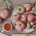 Fresh Vegetables Including Tomatoes and Carrots on Wooden Table with Plate and Cutting Board