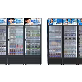 Commercial Display Refrigerators with Glass Doors Stocked with Various Beverages and Top Advertising Signs